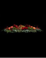 Arrangement of hydrangeas, pomegranates, roses, ilex, fir and candles 
