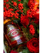 Arrangement of red roses, ilex, pomegranate, cinnamon, fir with Chivas regal 12,